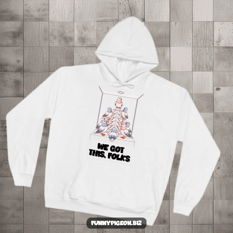 Funny pigeon project hoodie showing birds building a paper tower in a cubicle, offering warmth and office humor.